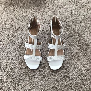 White sandals with a low heel